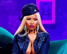 a pixelated image of a woman wearing a baseball cap