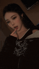 a woman taking a selfie wearing a shirt that says " love is mess "