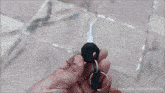 a blurred image of a person riding a scooter on a sidewalk with youtube.com/namastecar in the corner
