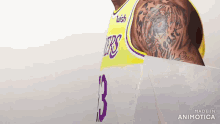 a basketball player wearing a yellow jersey with the number 13