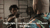a man pointing a gun at another man with the words that 's right may be a moron