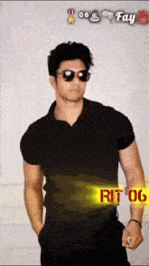 a man wearing sunglasses and a black shirt with the word fay on it