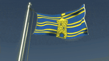 blue and yellow flag with a tower on it