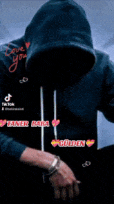 a man in a hooded sweatshirt with the words love you on the bottom