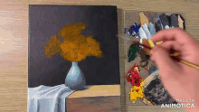 a painting of a vase of flowers is being painted by a person
