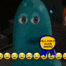 a blue ghost with a yellow ribbon that says fell for it again award on it