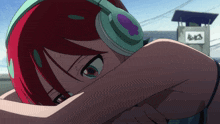 a girl with red hair is wearing headphones with a purple flower on the ear