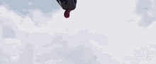 a spider-man holding a captain america shield on top of a white vehicle