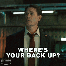 a man in a suit and tie asking where 's your back up