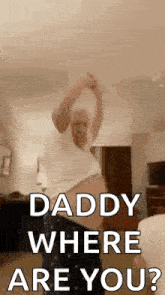 a man is dancing in a living room and asking daddy where are you ?
