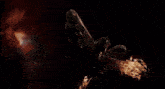 a close up of a statue of a monster in a dark room .