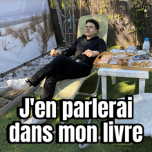 a man is laying in a chair with the words j'en parlerai dans mon livre below him