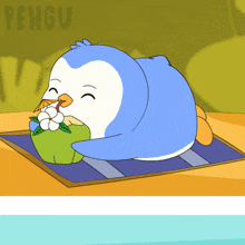 a cartoon of a penguin eating a coconut on a mat
