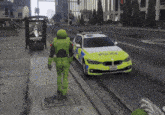 a yellow and white police car is driving down the road