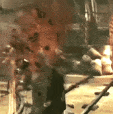 a blurred image of a person standing in a dark room .