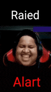a picture of a man wearing headphones with the words raised and alert below him .