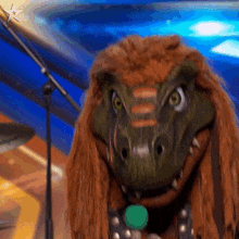 a close up of a dinosaur holding a microphone with a star in the background
