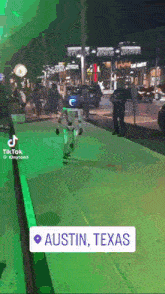 a video of a robot walking down a street in austin texas