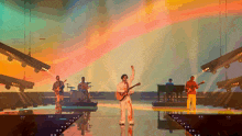 a man playing a guitar on stage with a band