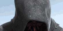 a close up of a person with a hood on