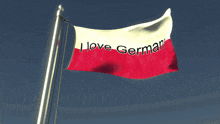 a red and white flag with the words i love german on it