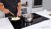 a man is stirring butter in a frying pan on an induction stove top