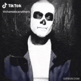 a black and white photo of a person wearing a skeleton mask .