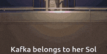 a person holding an umbrella with the words kafka belongs to her sol
