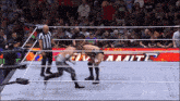a man in a wrestling ring with the word dynamite on the wall