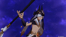 a person in a costume is holding a spear in their hand .