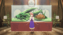 a girl in a purple dress is standing in front of a large fish tank