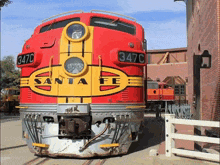 a red and yellow santa fe train with 347c written on the front