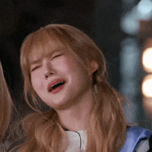 a woman with blonde hair making a funny face