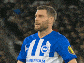 a man wearing a blue and white striped jersey that says american on it