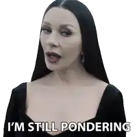 a woman in a black dress has the words i 'm still pondering on her face