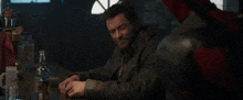 a man sitting at a bar with the words " i 'm not interested " written above him