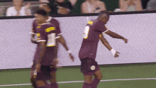 a soccer player wearing a jersey with the number 2 on it