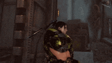 a woman in a green and black armor is standing in front of a screen that says gameshark