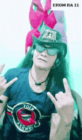 a man wearing a hat sunglasses and a t-shirt with the word crom on it