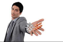 a man in a suit and tie is holding a sword and bacon