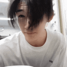 a close up of a person wearing a white t-shirt that says cgr