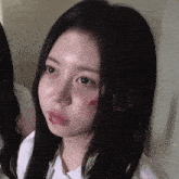 a close up of a girl with a bloody lip