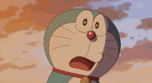 a cartoon character named doraemon is smiling with his mouth wide open