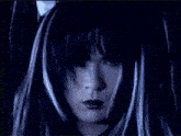 a close up of a woman 's face with a light coming out of it