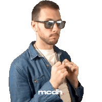 a man wearing sunglasses and a denim shirt has the letters mcdh on his shirt