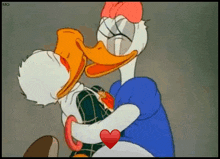 donald duck and daisy duck kissing in a cartoon .