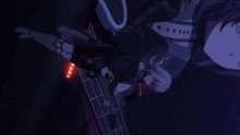 a girl is holding a guitar in front of a man with a black shirt that says kaoru