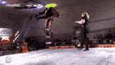 two wrestlers in a ring with wr written on the ring