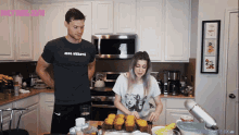 a man and a woman are cooking in a kitchen with the words daily subs 30k on the bottom