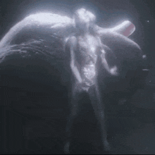 a glowing object is floating in the dark with a blurred background